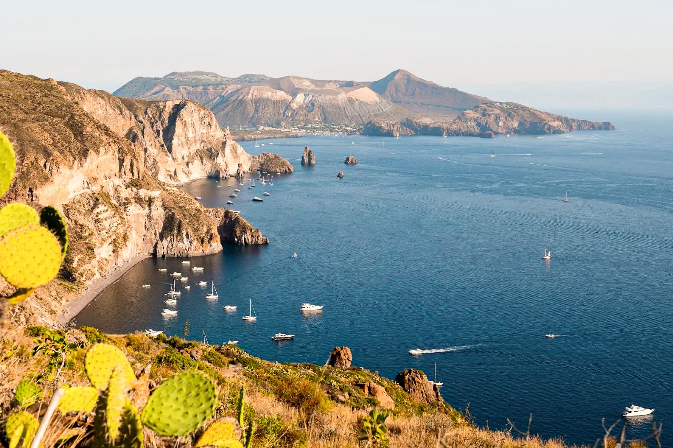 Belvedere Quattrocchi viewpoint overlooking the Faraglioni sea stacks and Vulcano, Lipari
