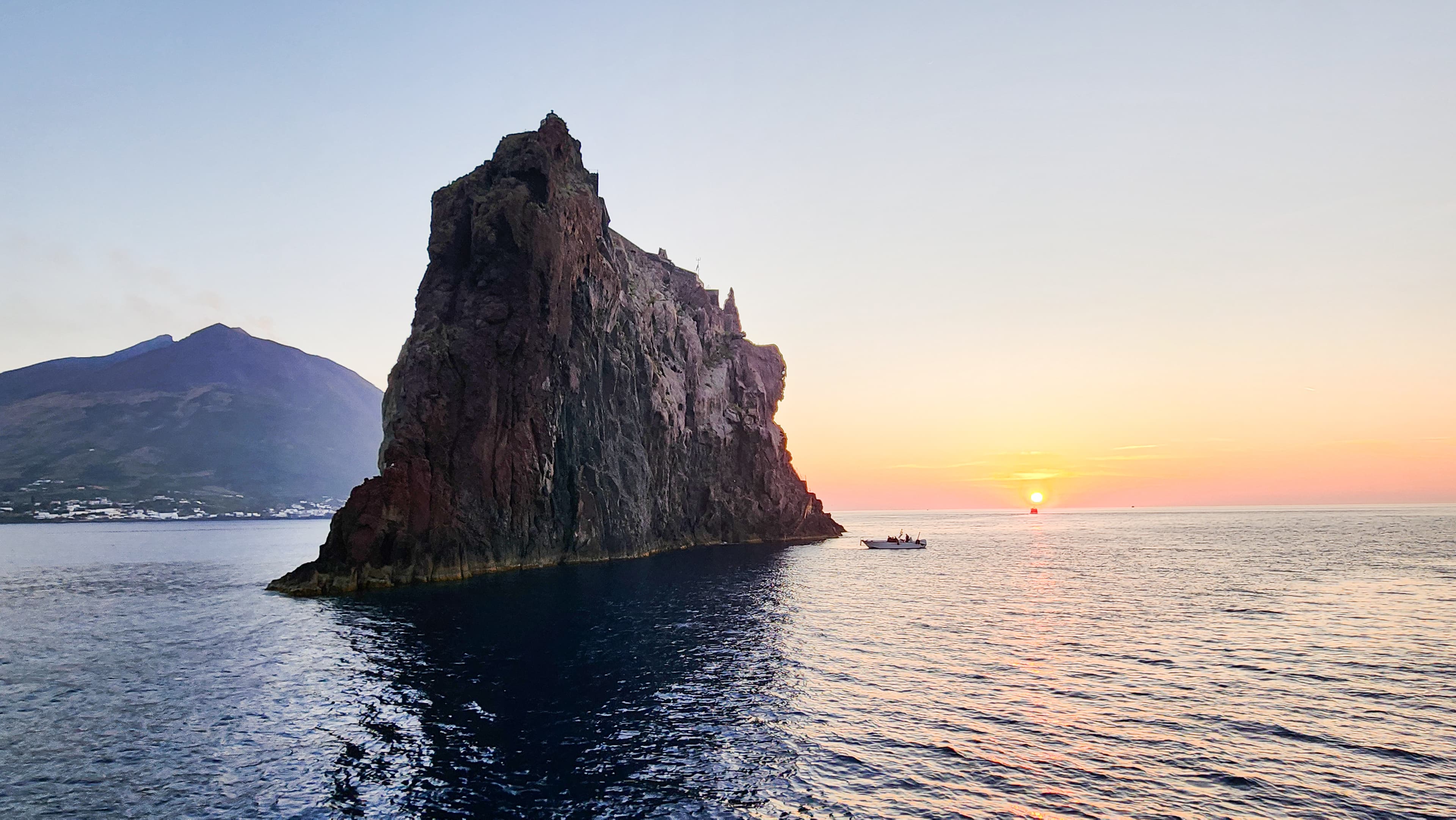 Stromboli volcano at dusk viewed from a boat, Aeolian Islands