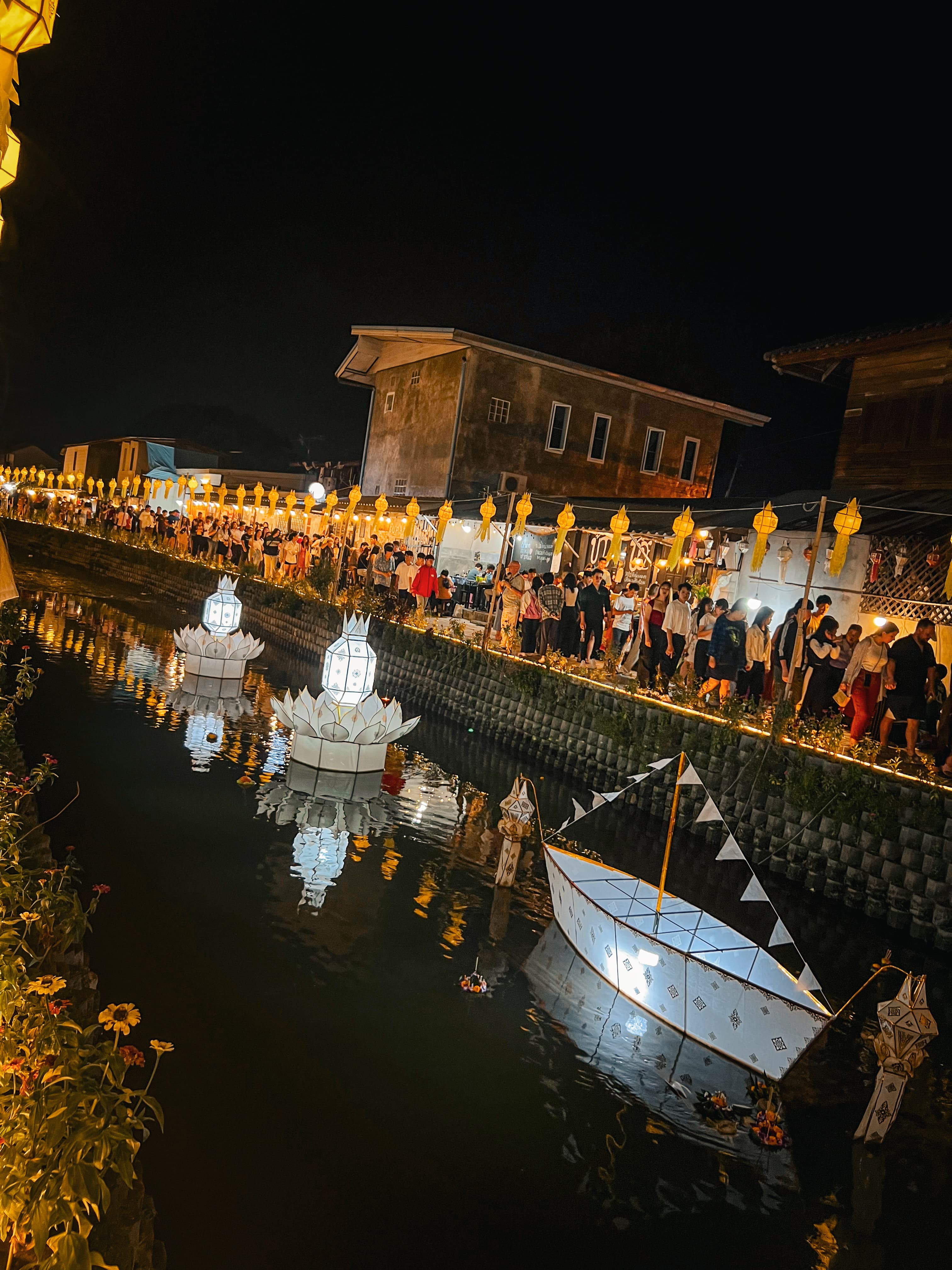 Loy Krathong lantern baskets floating on the Ping River, Chiang Mai